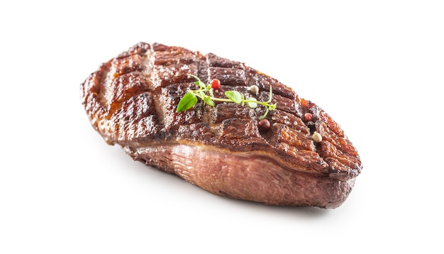 Grilled duck breast on an isolated white background.