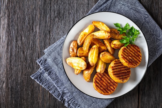Grilled fish burgers with baked potato wedges