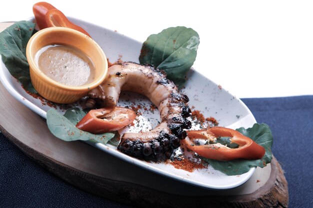 Grilled Galician octopus leg with sauce