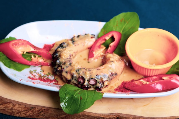 Grilled Galician octopus leg with sauce