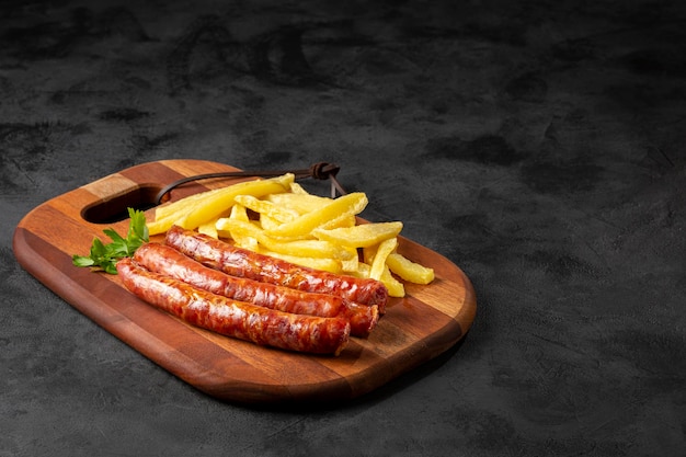 Grilled German sausage with french fries.