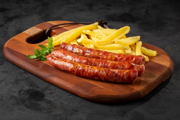 Grilled German sausage with french fries.