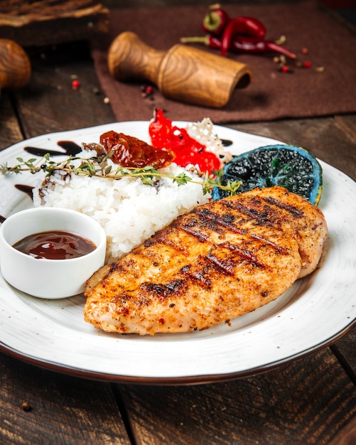 Grilled gourmet chicken fillet steak with rice