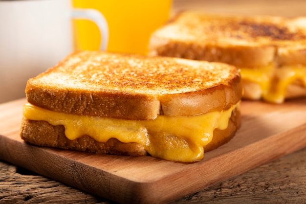 Grilled ham and cheese Sandwich with cheese and ham on grill