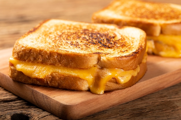 Grilled ham and cheese Sandwich with cheese and ham on grill