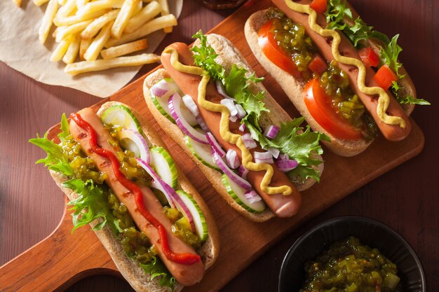 Grilled hot dogs with vegetables ketchup mustard