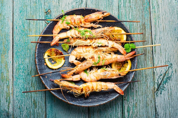 Grilled langoustines,prawn roasted on a skewer.Grilled seafood plate