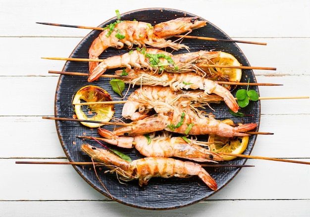 Grilled langoustines,prawn roasted on a skewer.Grilled seafood plate