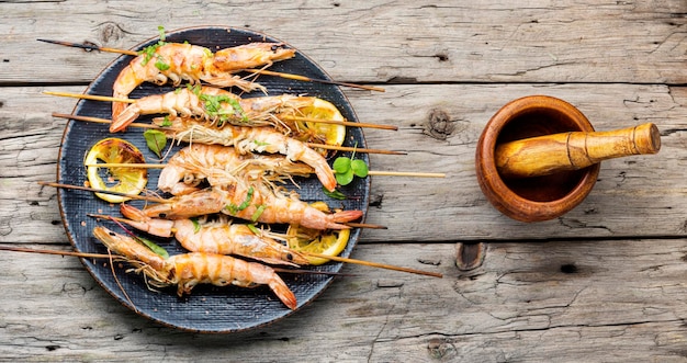 Grilled langoustines,prawn roasted on a skewer.Grilled seafood plate