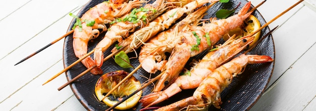 Grilled langoustines,prawn roasted on a skewer.Grilled seafood plate