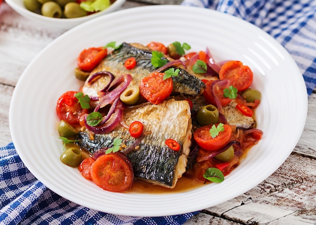 Grilled mackerel with vegetables in Mediterranean style. Top view