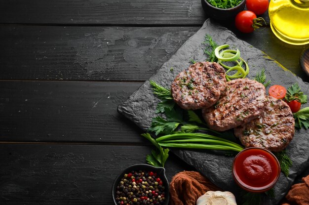 Grilled meat cutlets Cutlets for burger Top view Free space for your text