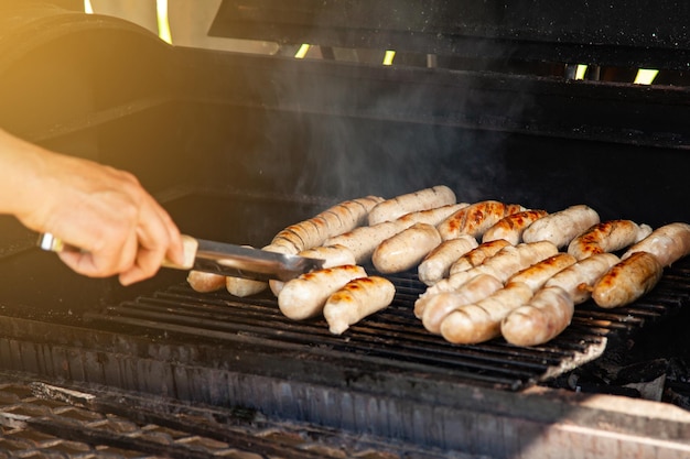 Grilled meat sausages on charcoal grill