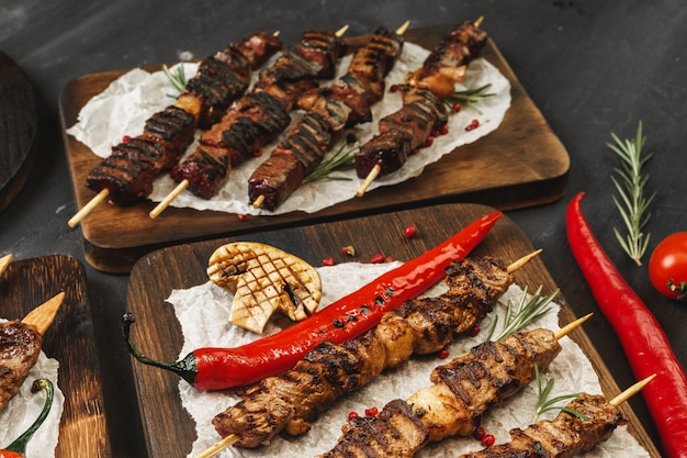 Photo grilled meat skewers barbecue served on board. kebab meat