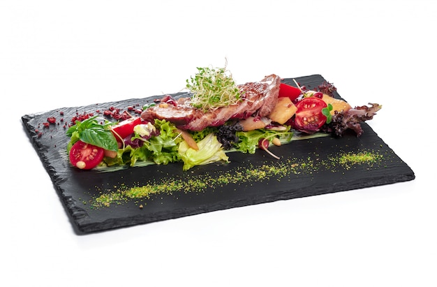 Grilled meat with beef, garnished with tomatoes ,lettuce