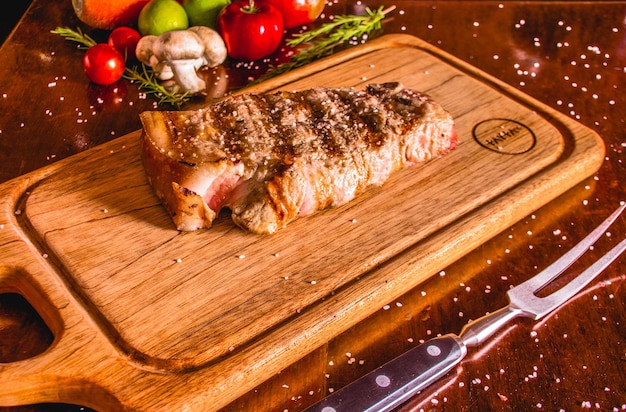 GRILLED MEAT ON A WOODEN TABLE