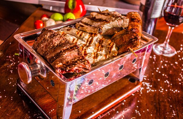 GRILLED MEAT ON A WOODEN TABLE