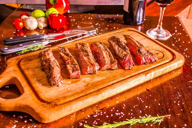 GRILLED MEAT ON A WOODEN TABLE