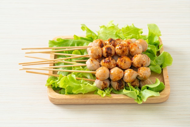 grilled meatballs skewer with spicy dipping sauce