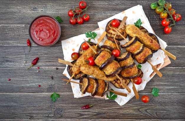 Grilled meatballs with eggplant on skewers