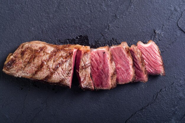 Grilled New York steak meat Food background