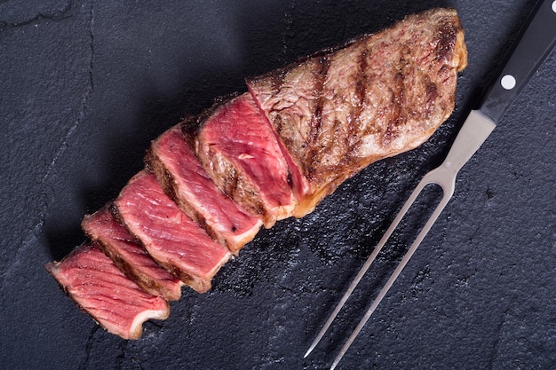 Grilled New York steak meat Food background