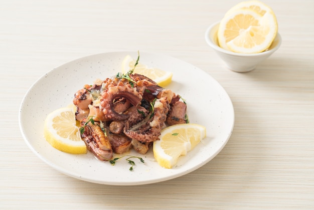 Grilled octopus or squid with butter lemon sauce and thyme