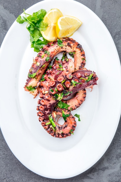 Grilled octopus on a white plate