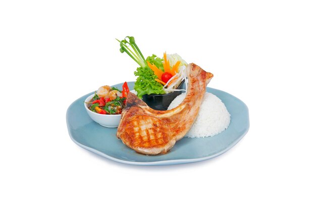 Grilled or pan fried pork chop with lychee and Thai basil sauceFusion food on white background