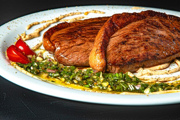 Grilled picanha served with salad and cream