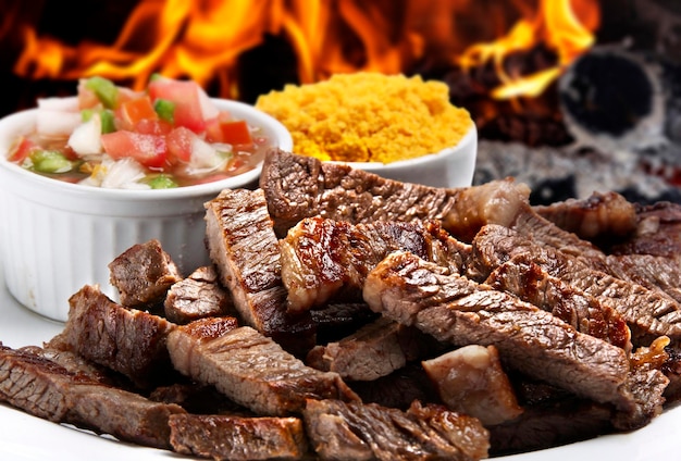 Grilled picanha with rice farofa and salad