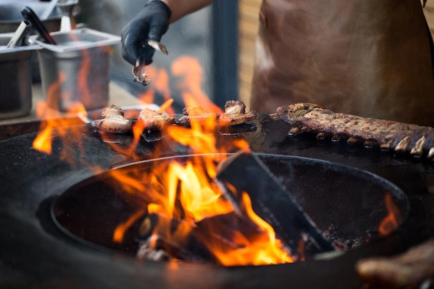 Grilled pork baby ribs with barbecue sauce on the grill Festival street food