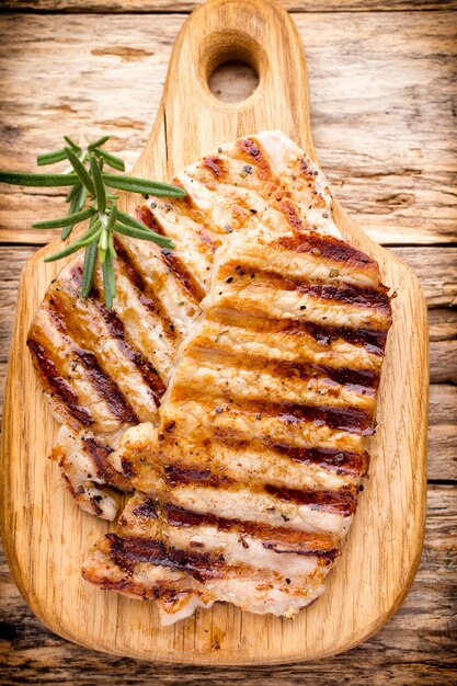 Grilled pork chops pieces. Spices and rosemary.