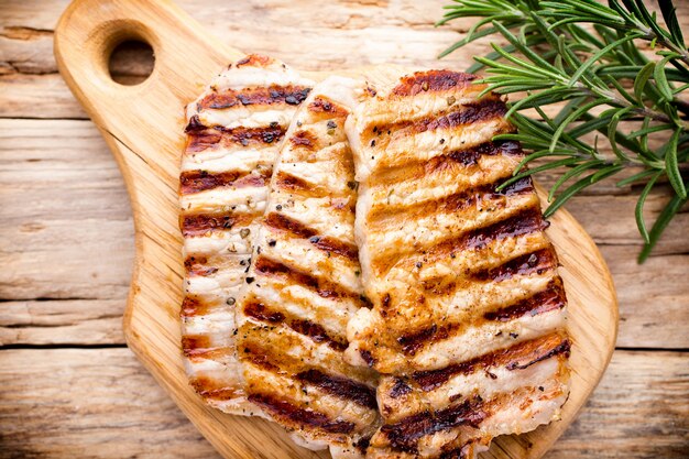 Grilled pork chops pieces. Spices and rosemary.