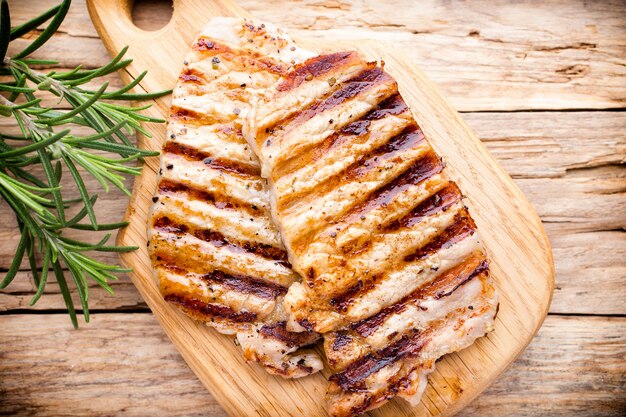 Grilled pork chops pieces. Spices and rosemary.