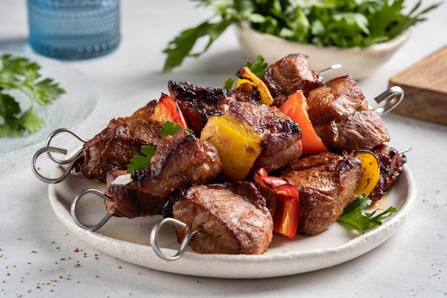 Grilled pork kebab with red and yellow pepper