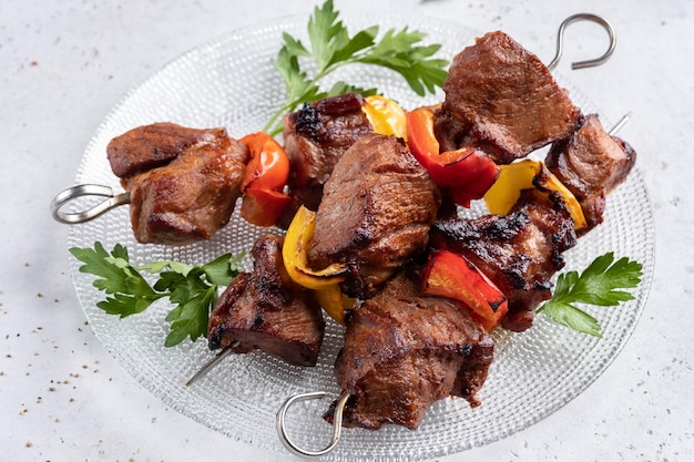 Grilled pork kebab with red and yellow pepper