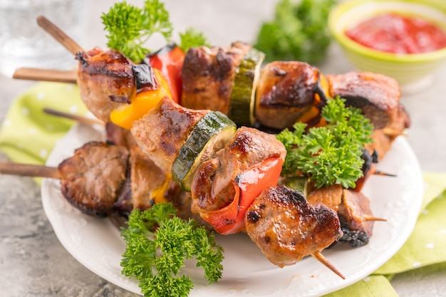 Grilled pork kebab with red and yellow pepper