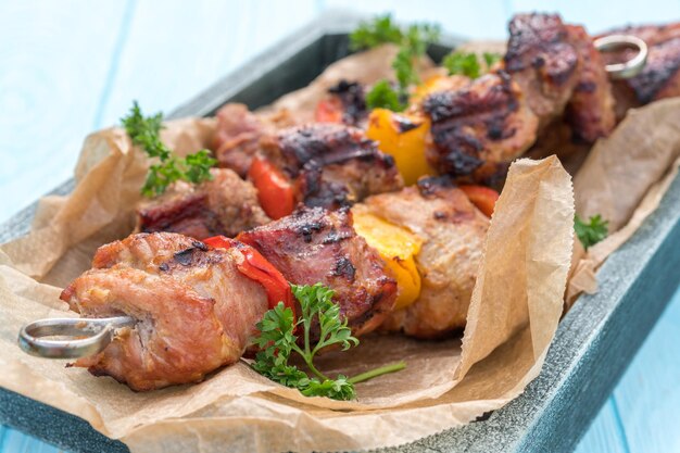 Grilled pork kebab with red and yellow pepper