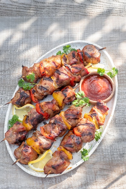 Grilled pork kebab with red and yellow pepper