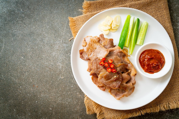 Grilled pork neck sliced on plate