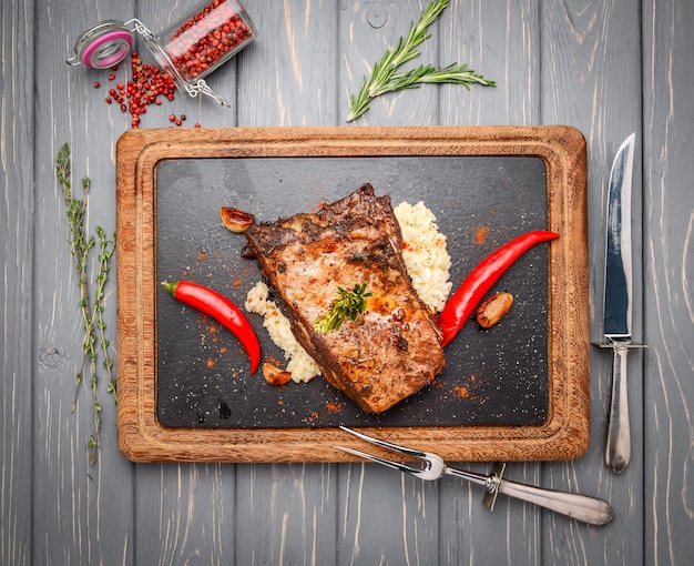 Grilled pork ribs with rice on wooden