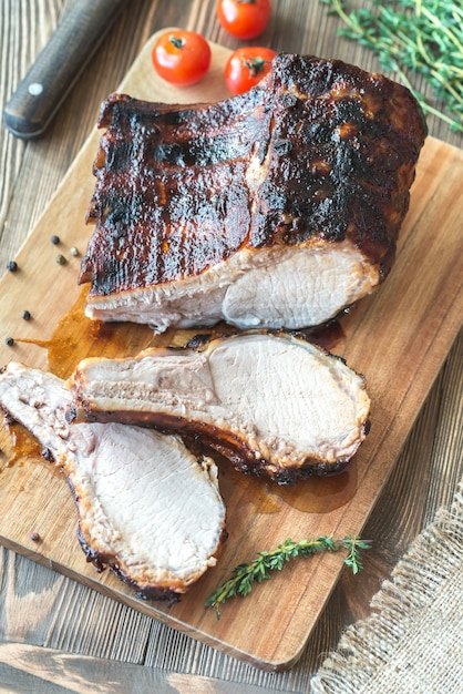 Grilled pork ribs on wooden board