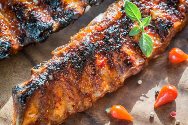 Grilled pork ribs on wooden board