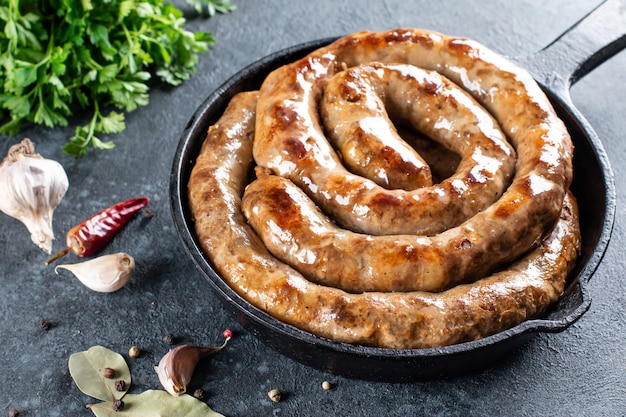 Grilled pork sausage in the shape of a spiral