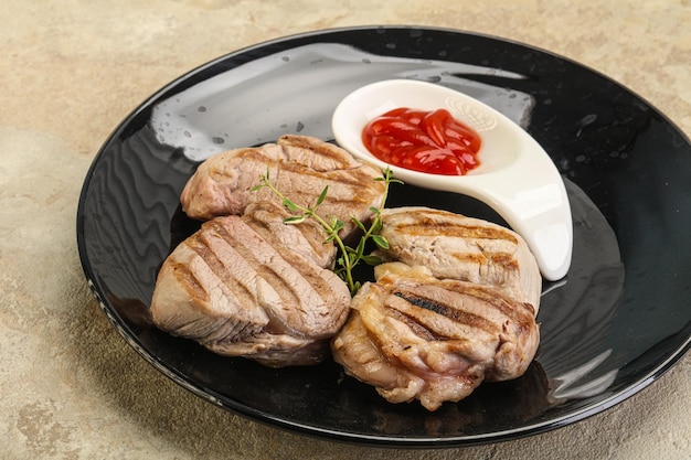 Grilled pork tenderlion with tomato sauce