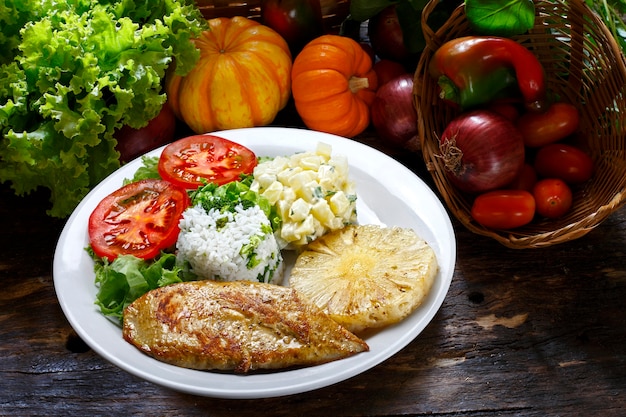 Grilled pork with fries and vegetables