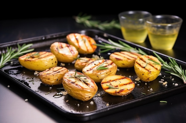 Grilled potatoes with rosemary on a stone tray