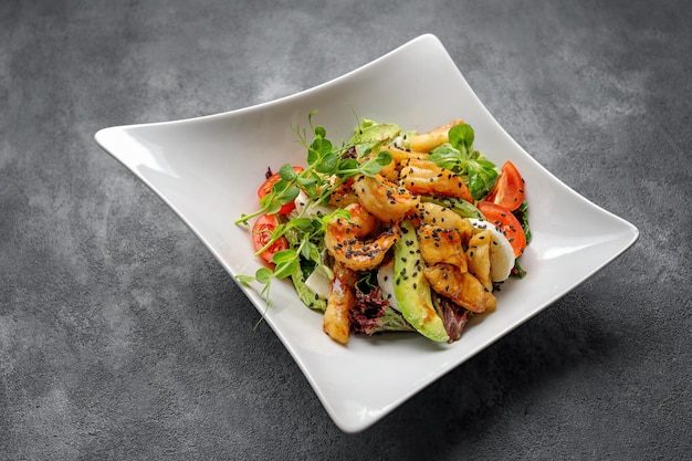 Grilled prawns with avocado tomatoes and quail eggs