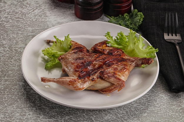 Grilled quail in the plate